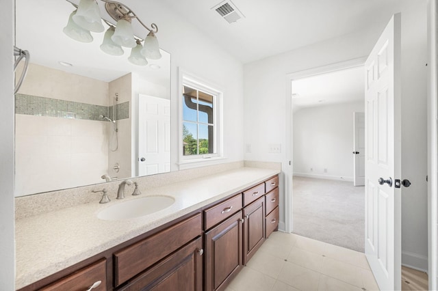 1008 Green Hill Cv, Brentwood, TN 37027 - full bath featuring tile patterned floors, a tile shower, baseboards, visible vents, and vanity