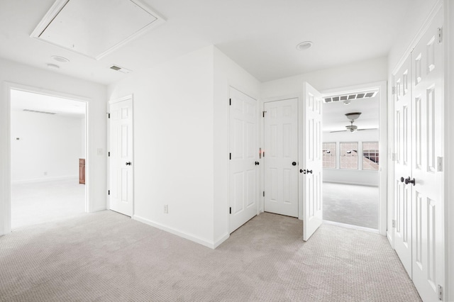1008 Green Hill Cv, Brentwood, TN 37027 - unfurnished bedroom with visible vents, attic access, baseboards, and light colored carpet