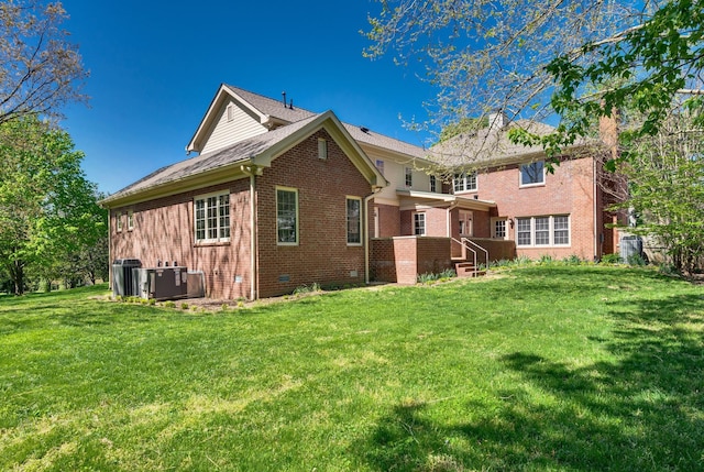 1008 Green Hill Cv, Brentwood, TN 37027 - back of house featuring a lawn, a chimney, and brick siding