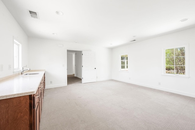 1008 Green Hill Cv, Brentwood, TN 37027 - unfurnished living room with recessed lighting, visible vents, light carpet, a sink, and baseboards