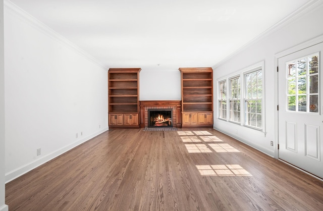 1008 Green Hill Cv, Brentwood, TN 37027 - unfurnished living room featuring baseboards, wood finished floors, a fireplace, and ornamental molding