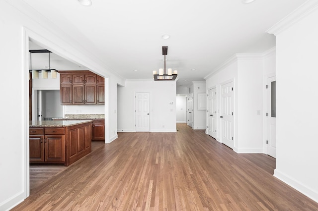 1008 Green Hill Cv, Brentwood, TN 37027 - unfurnished dining area with a chandelier, wood finished floors, and baseboards