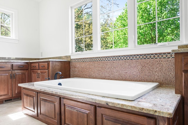 1008 Green Hill Cv, Brentwood, TN 37027 - full bath with a bathing tub, tile patterned floors, visible vents, and plenty of natural light