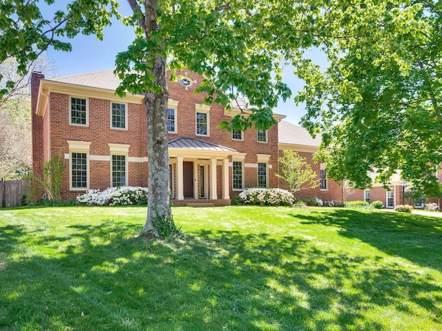 1008 Green Hill Cv, Brentwood, TN 37027 - back of house with brick siding, a lawn, and a chimney