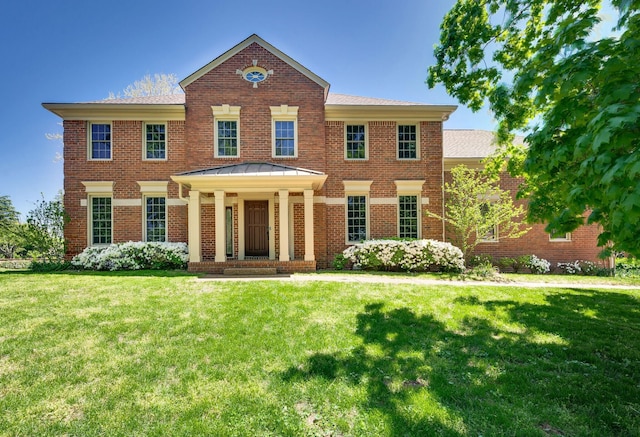1008 Green Hill Cv, Brentwood, TN 37027 - colonial house with brick siding, a standing seam roof, and a front yard