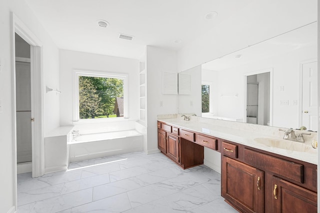 1008 Green Hill Cv, Brentwood, TN 37027 - bathroom featuring a bath, marble finish floor, a sink, and double vanity