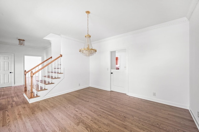 1008 Green Hill Cv, Brentwood, TN 37027 - unfurnished room featuring wood finished floors, an inviting chandelier, stairs, and crown molding