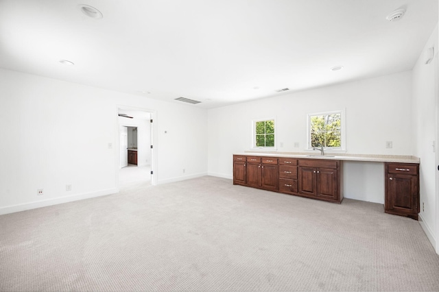 1008 Green Hill Cv, Brentwood, TN 37027 - interior space featuring visible vents, light carpet, baseboards, and a sink