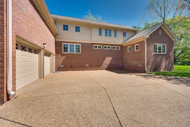 1008 Green Hill Cv, Brentwood, TN 37027 - back of property featuring brick siding, driveway, crawl space, and a garage
