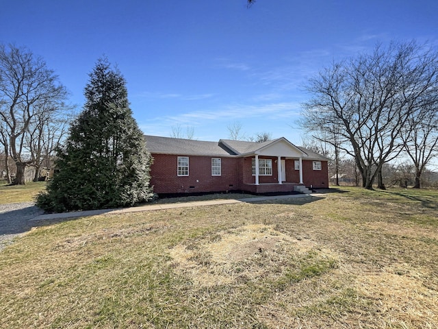 958 Clearview Rd, Cottontown, TN 37048 - view of front of home featuring brick siding, a front lawn, and crawl space