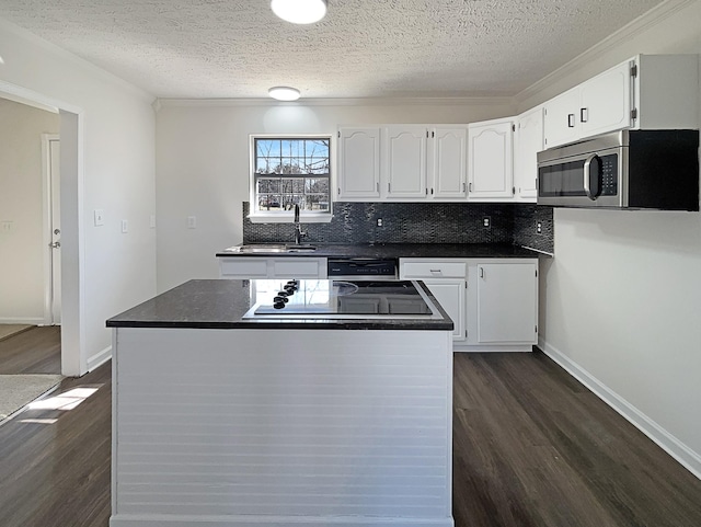 958 Clearview Rd, Cottontown, TN 37048 - kitchen featuring stainless steel microwave, dark wood-style flooring, a sink, and white cabinets