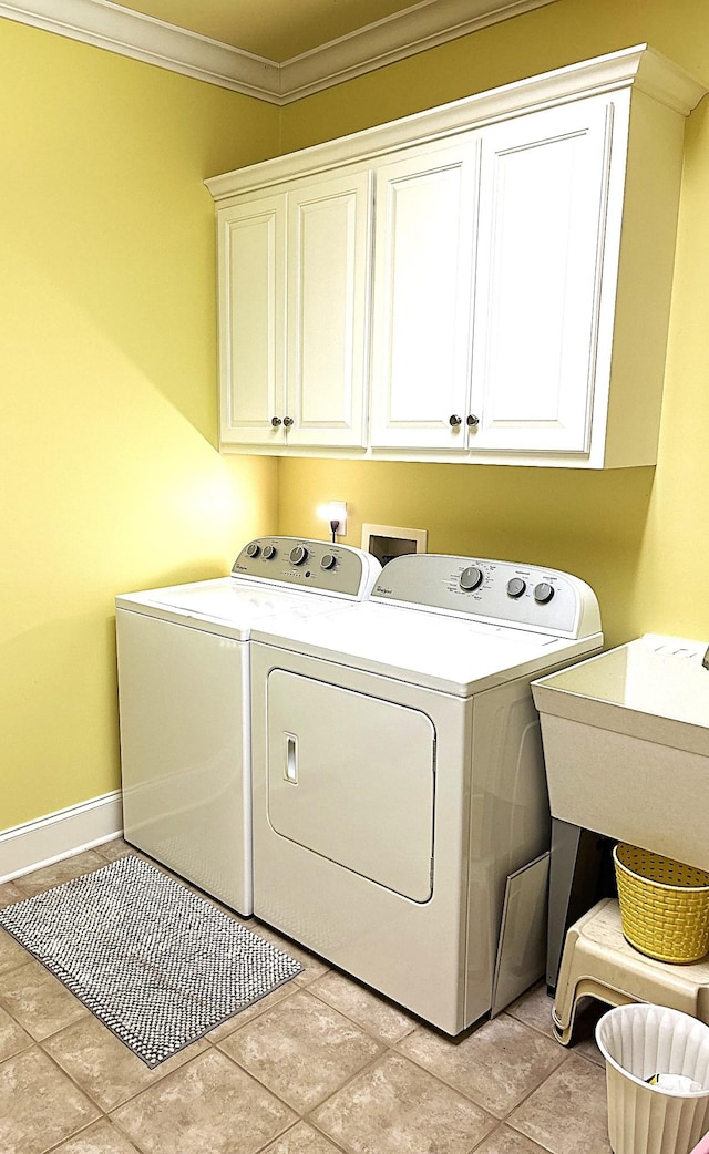 247 Woods Ferry Cir, Gallatin, TN 37066 - laundry room with washer and clothes dryer, cabinet space, crown molding, and baseboards