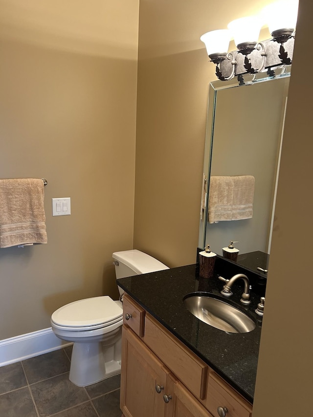 247 Woods Ferry Cir, Gallatin, TN 37066 - bathroom featuring tile patterned floors, vanity, toilet, and baseboards