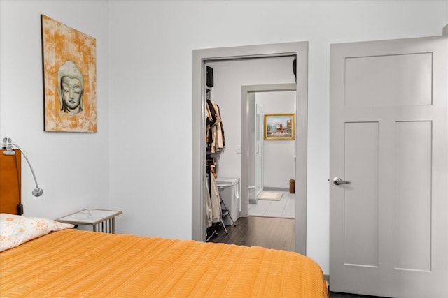1638 54th Ave N Unit 320, Nashville, TN 37209 - bedroom with baseboards and dark wood-style floors