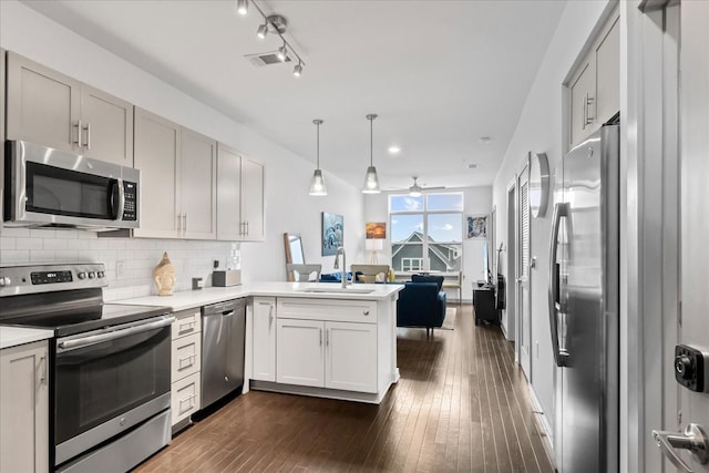 1638 54th Ave N Unit 320, Nashville, TN 37209 - kitchen with a ceiling fan, a sink, stainless steel appliances, a peninsula, and visible vents