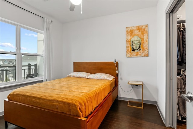 1638 54th Ave N Unit 320, Nashville, TN 37209 - bedroom featuring dark wood-type flooring, a ceiling fan, and baseboards