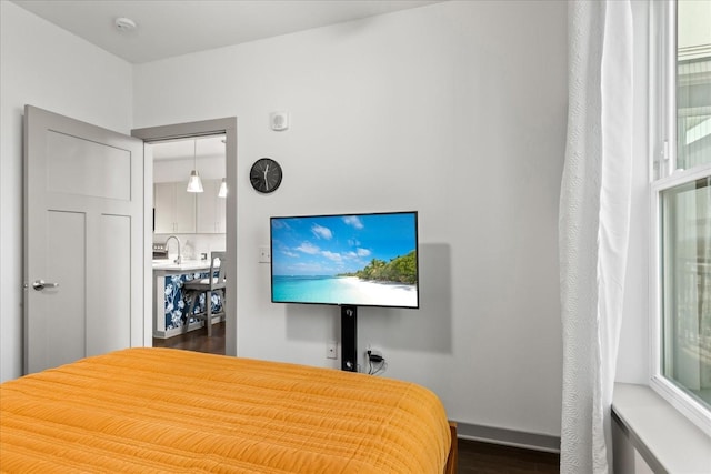1638 54th Ave N Unit 320, Nashville, TN 37209 - bedroom featuring baseboards and dark wood-style flooring