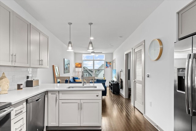 1638 54th Ave N Unit 320, Nashville, TN 37209 - kitchen featuring stainless steel appliances, backsplash, a sink, a peninsula, and ceiling fan