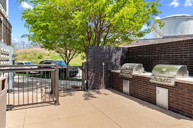 1638 54th Ave N Unit 320, Nashville, TN 37209 - view of patio / terrace featuring grilling area and an outdoor kitchen