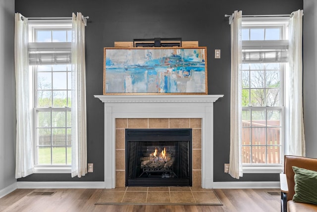 3051 Outfitters Dr, Clarksville, TN 37040 - details with visible vents, baseboards, wood finished floors, and a fireplace