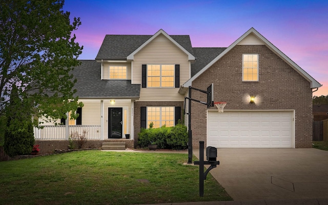 3051 Outfitters Dr, Clarksville, TN 37040 - traditional-style home with driveway, brick siding, a garage, a lawn, and a shingled roof