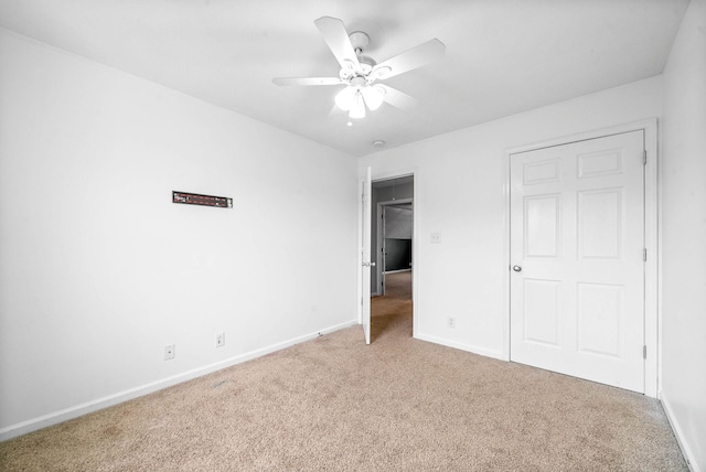3051 Outfitters Dr, Clarksville, TN 37040 - unfurnished bedroom with a ceiling fan, baseboards, and light carpet