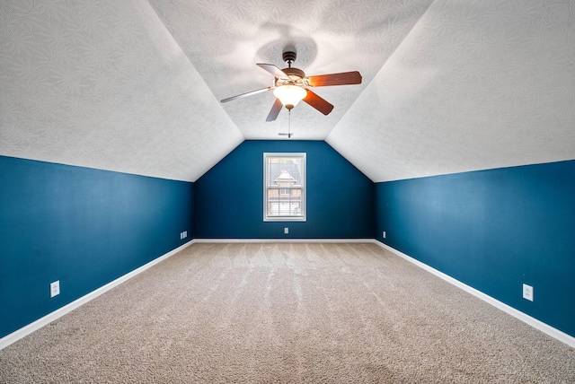 3051 Outfitters Dr, Clarksville, TN 37040 - bonus room featuring vaulted ceiling, carpet flooring, a textured ceiling, and a ceiling fan