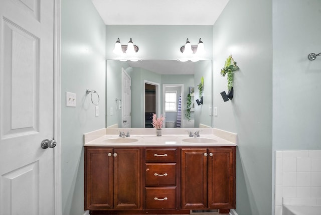3051 Outfitters Dr, Clarksville, TN 37040 - bathroom with a tub, visible vents, a sink, and double vanity