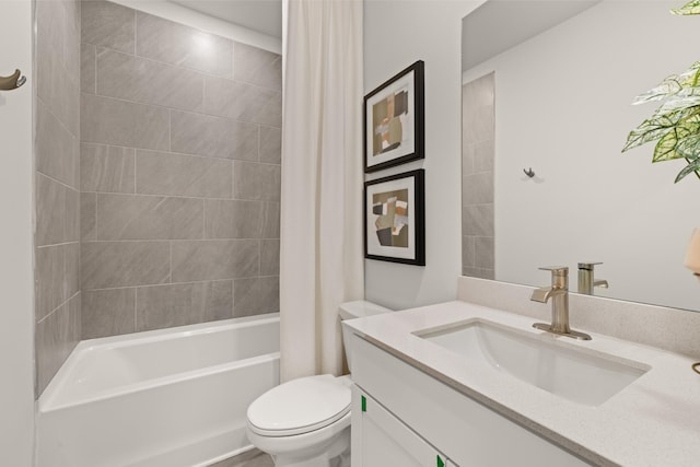 bathroom featuring toilet, vanity, and shower / bath combo with shower curtain