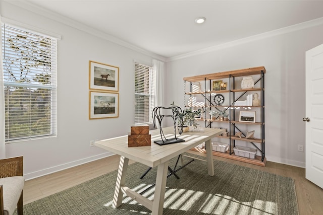 office space featuring baseboards, wood finished floors, and ornamental molding
