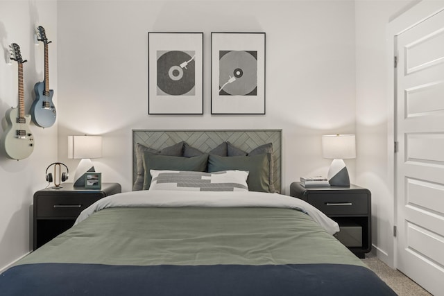 bedroom featuring baseboards and carpet flooring