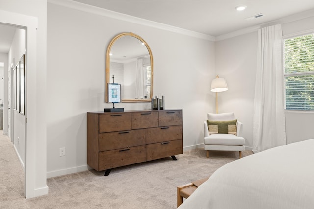bedroom featuring baseboards, light colored carpet, and crown molding