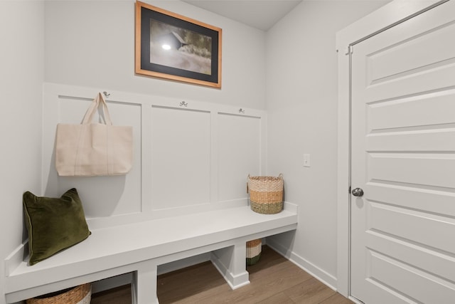 mudroom with baseboards and wood finished floors