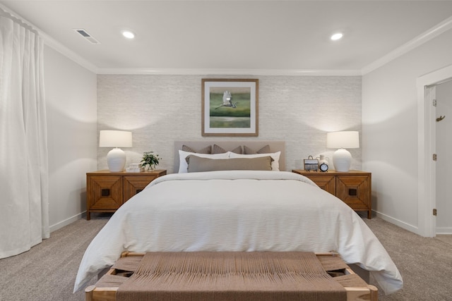 carpeted bedroom featuring baseboards, ornamental molding, and visible vents