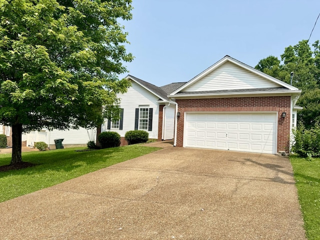 1456 Brighton Cir, Old Hickory, TN 37138 - view of front of property with concrete driveway, a front lawn, a garage, and brick siding