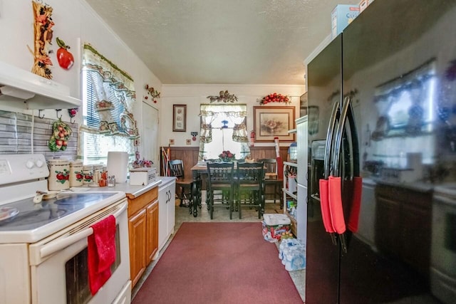 kitchen with white range with electric cooktop, a textured ceiling, black fridge with ice dispenser, light countertops, and under cabinet range hood