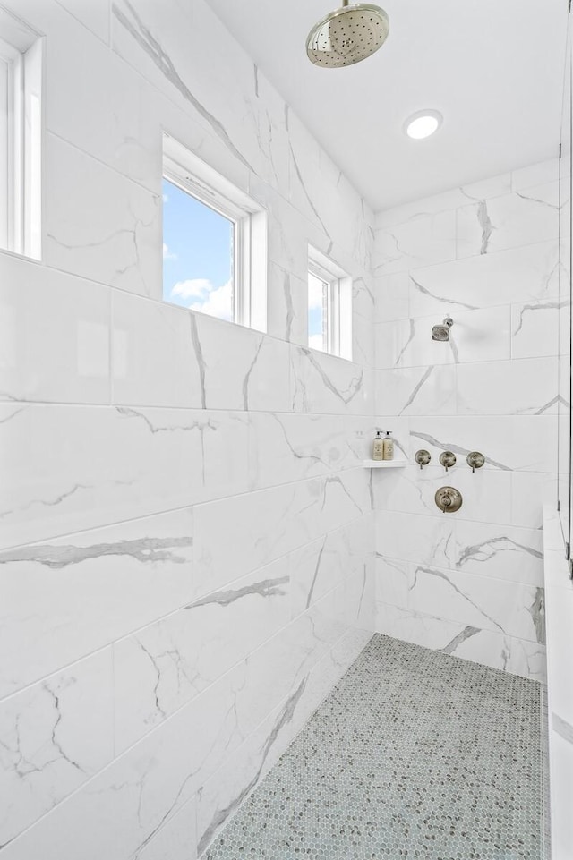 bathroom with a tile shower