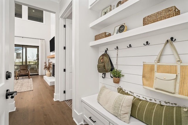 mudroom with baseboards and dark wood-style flooring
