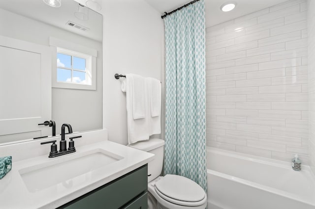 bathroom featuring shower / tub combo, visible vents, vanity, and toilet