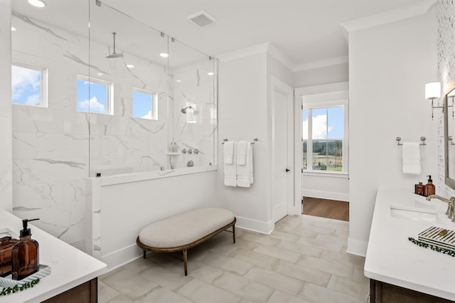 bathroom featuring double vanity, visible vents, ornamental molding, a marble finish shower, and a sink