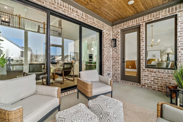 sunroom / solarium featuring an outdoor hangout area and an inviting chandelier