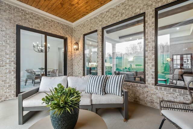 sunroom with a chandelier