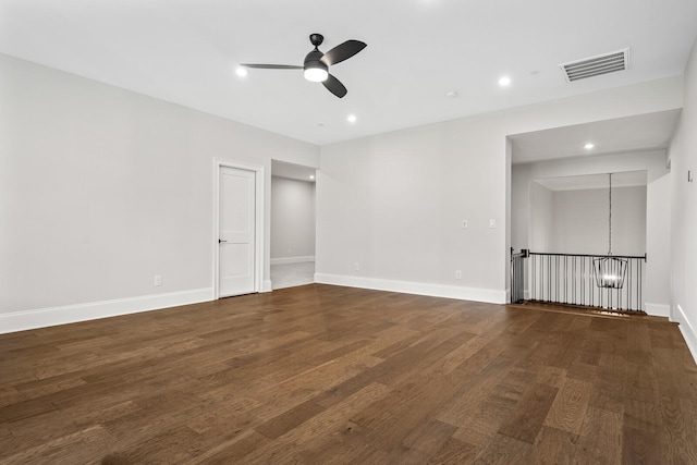 unfurnished bedroom featuring baseboards, wood finished floors, visible vents, and recessed lighting