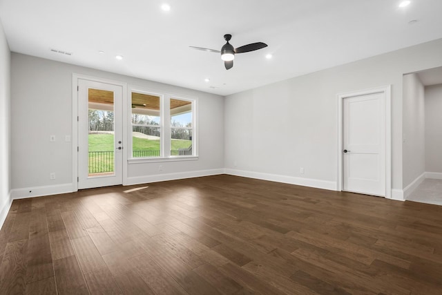 empty room with a ceiling fan, visible vents, baseboards, dark wood-style floors, and recessed lighting