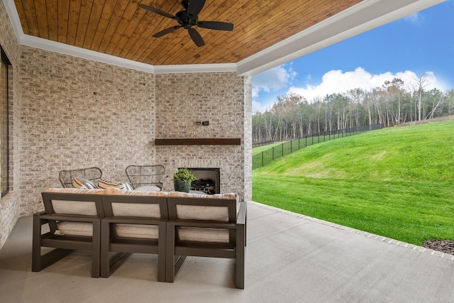 view of patio with an outdoor living space with a fireplace, a ceiling fan, and fence