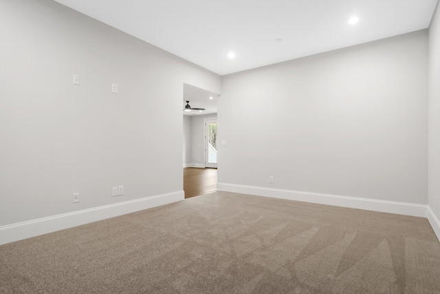 unfurnished room featuring baseboards, carpet floors, and recessed lighting