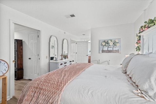 470 S Main St Unit 106, Ashland City, TN 37015 - bedroom with light wood finished floors and visible vents