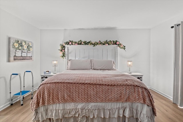 470 S Main St Unit 106, Ashland City, TN 37015 - bedroom featuring baseboards and light wood-style floors