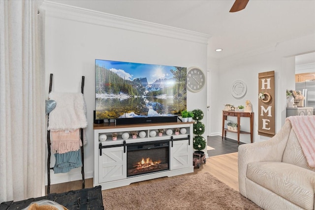 470 S Main St Unit 106, Ashland City, TN 37015 - living area featuring recessed lighting, wood finished floors, ornamental molding, a glass covered fireplace, and ceiling fan