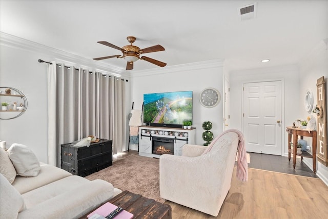 470 S Main St Unit 106, Ashland City, TN 37015 - living area with visible vents, recessed lighting, a ceiling fan, ornamental molding, and a lit fireplace